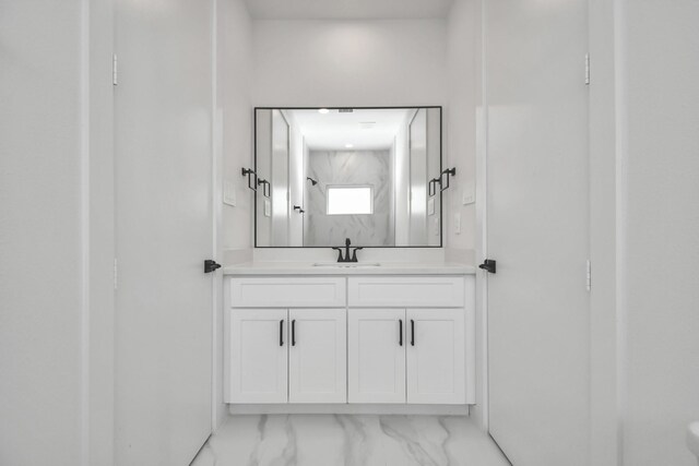 853 Mansfield St Unit D, Houston, TX 77091 - bathroom with vanity and marble look tiles