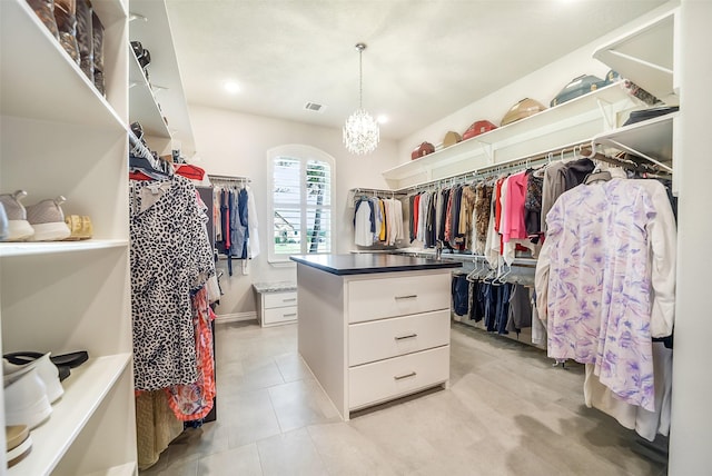 22414 Meadowhurst Cir W, Tomball, TX 77377 - spacious closet featuring arched walkways and light tile patterned floors