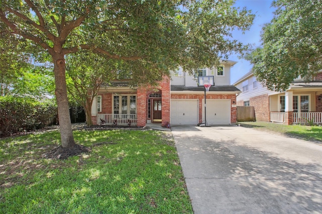 9103 Huckinston Ct, Spring, TX 77379 - view of property hidden behind natural elements with covered porch, an attached garage, concrete driveway, and brick siding