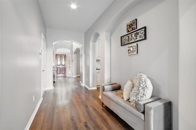 9103 Huckinston Ct, Spring, TX 77379 - corridor featuring arched walkways, dark wood-style flooring, and baseboards