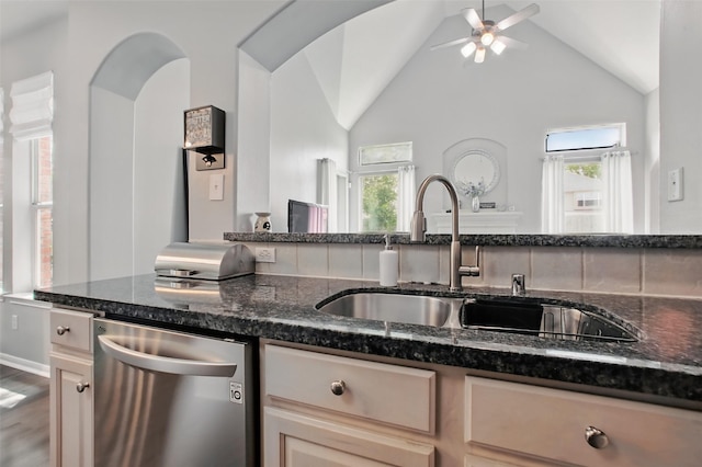 9103 Huckinston Ct, Spring, TX 77379 - kitchen with stainless steel dishwasher, a sink, plenty of natural light, a ceiling fan, and vaulted ceiling