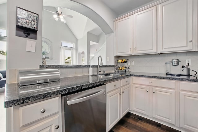 9103 Huckinston Ct, Spring, TX 77379 - kitchen featuring dishwasher, a sink, ceiling fan, dark stone countertops, and lofted ceiling
