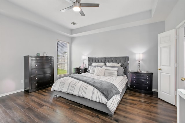 9103 Huckinston Ct, Spring, TX 77379 - bedroom with wood finished floors, a raised ceiling, baseboards, and a ceiling fan