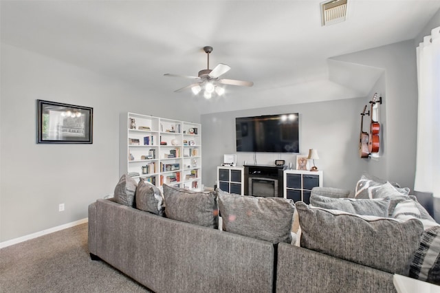 9103 Huckinston Ct, Spring, TX 77379 - living room featuring a ceiling fan, baseboards, and carpet flooring