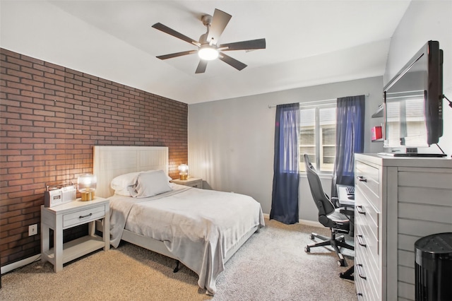 9103 Huckinston Ct, Spring, TX 77379 - bedroom with brick wall, light carpet, a ceiling fan, and baseboards
