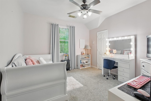 9103 Huckinston Ct, Spring, TX 77379 - bedroom featuring a desk, light colored carpet, vaulted ceiling, a ceiling fan, and baseboards
