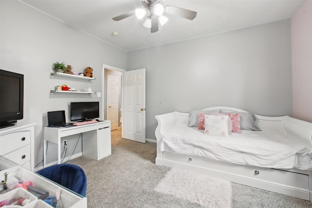 9103 Huckinston Ct, Spring, TX 77379 - bedroom featuring light carpet, baseboards, and ceiling fan