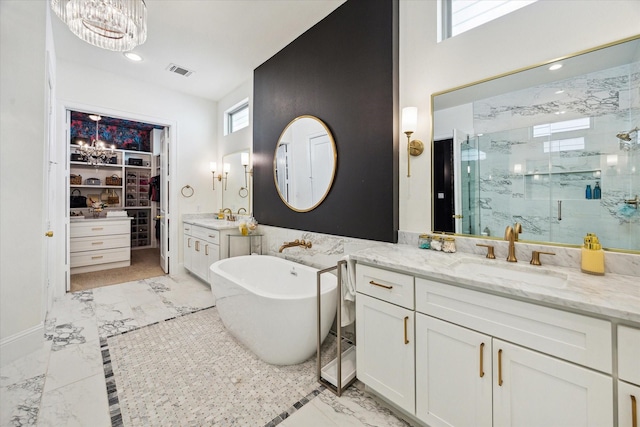619 W 26th St, Houston, TX 77008 - full bath featuring a marble finish shower, marble finish floors, vanity, a soaking tub, and a walk in closet