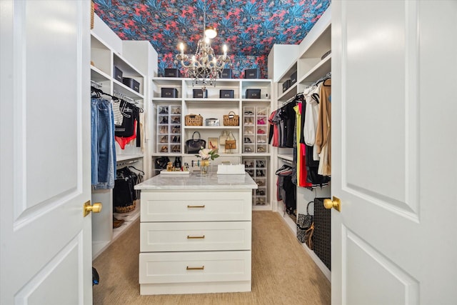 619 W 26th St, Houston, TX 77008 - walk in closet with light colored carpet and a chandelier