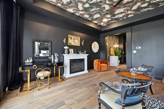 619 W 26th St, Houston, TX 77008 - living room featuring wood finished floors and a glass covered fireplace