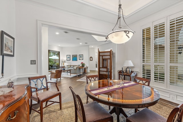 13614 Champions Centre Dr, Houston, TX 77069 - dining area with wood finished floors, recessed lighting, a wainscoted wall, a decorative wall, and ornamental molding