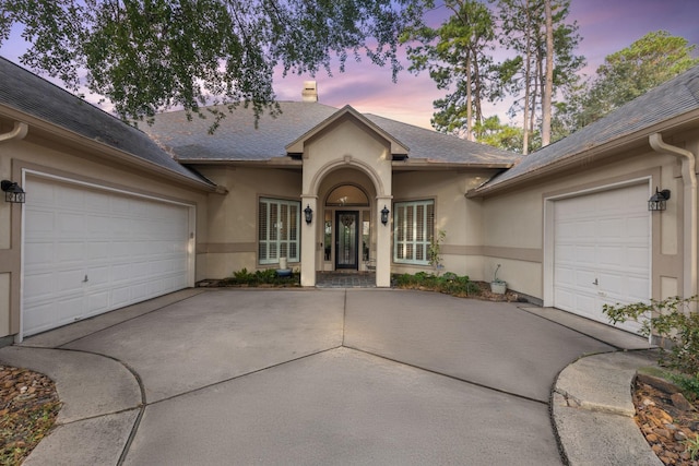 13614 Champions Centre Dr, Houston, TX 77069 - ranch-style house featuring driveway, an attached garage, stucco siding, and a shingled roof