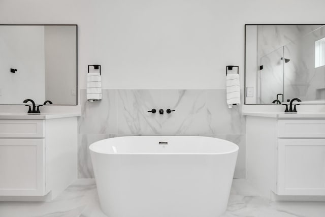 849 Mansfield St Unit B, Houston, TX 77091 - full bath featuring marble finish flooring, tile walls, two vanities, a marble finish shower, and a freestanding bath