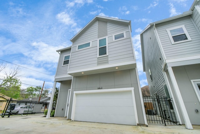 849 Mansfield St Unit B, Houston, TX 77091 - view of front of home with an attached garage and driveway