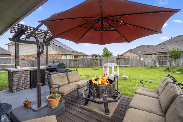 9210 Monarch Field Ln, Cypress, TX 77433 - wooden deck with a fenced backyard, an outdoor living space with a fire pit, a pergola, and a grill