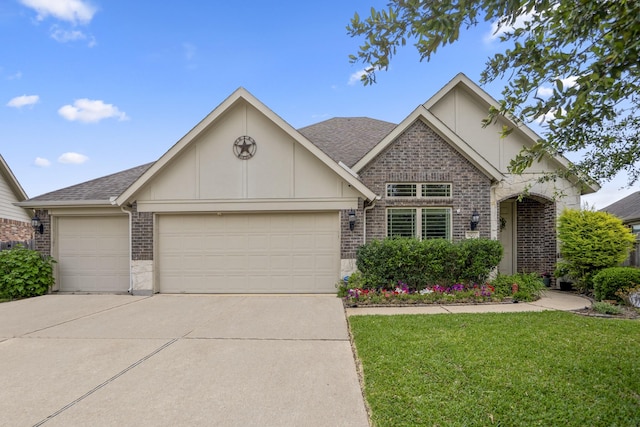 9210 Monarch Field Ln, Cypress, TX 77433 - view of front of property featuring brick siding, a garage, concrete driveway, a front yard, and roof with shingles