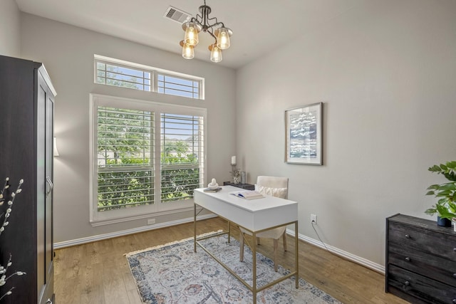 9210 Monarch Field Ln, Cypress, TX 77433 - home office featuring a chandelier and wood finished floors