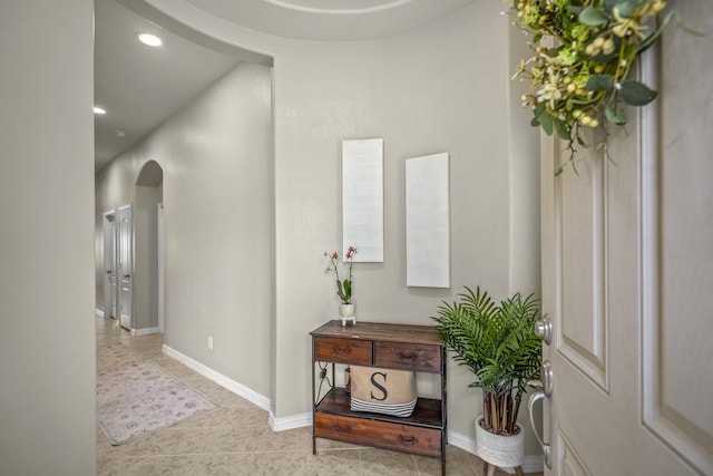 9210 Monarch Field Ln, Cypress, TX 77433 - hallway featuring arched walkways, tile patterned floors, and recessed lighting
