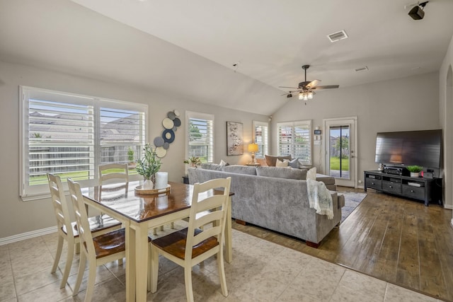 9210 Monarch Field Ln, Cypress, TX 77433 - tiled dining space with plenty of natural light, a ceiling fan, and vaulted ceiling