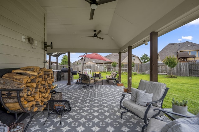 9210 Monarch Field Ln, Cypress, TX 77433 - fenced backyard featuring ceiling fan, a patio area, and grilling area