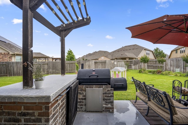 9210 Monarch Field Ln, Cypress, TX 77433 - fenced backyard featuring area for grilling, a pergola, and a patio area