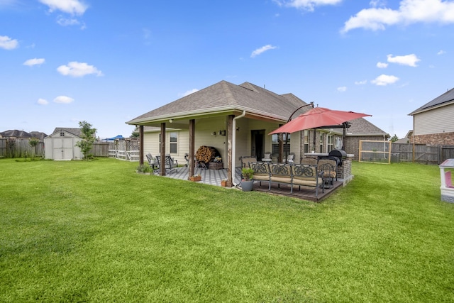 9210 Monarch Field Ln, Cypress, TX 77433 - rear view of house featuring a fenced backyard, a patio area, a storage unit, roof with shingles, and an outdoor living space