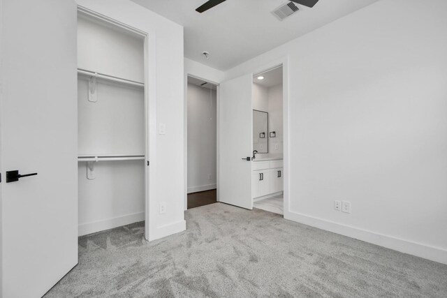 853 Mansfield St Unit C, Houston, TX 77091 - unfurnished bedroom with carpet floors, a closet, ensuite bathroom, and ceiling fan