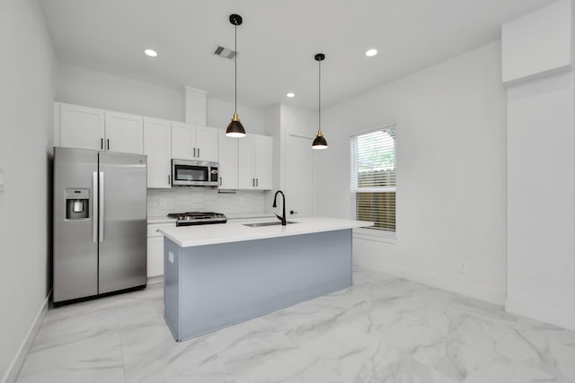 853 Mansfield St Unit C, Houston, TX 77091 - kitchen with appliances with stainless steel finishes, light marble finish floors, white cabinetry, backsplash, and recessed lighting