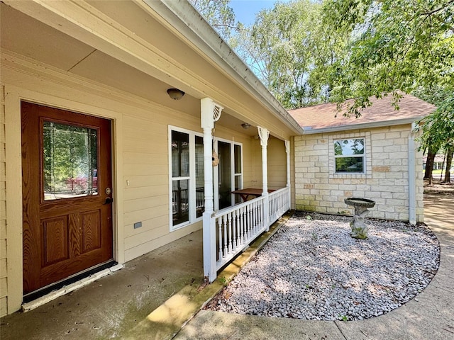 86 Huntington, Trinity, TX 75862 - view of exterior entry featuring roof with shingles