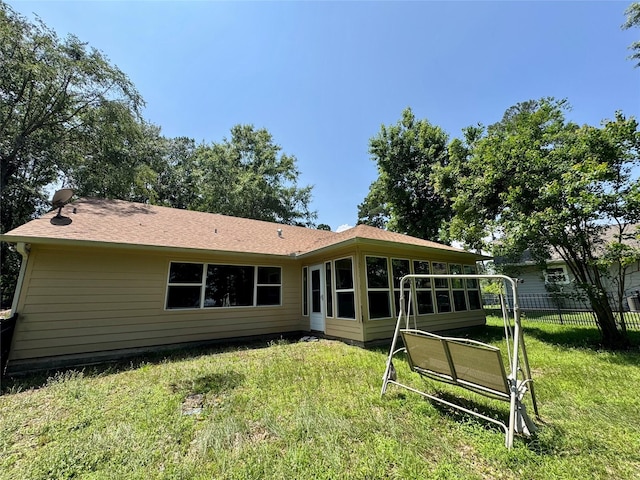 86 Huntington, Trinity, TX 75862 - back of house featuring a sunroom
