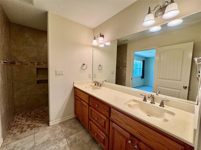86 Huntington, Trinity, TX 75862 - full bath with double vanity, tiled shower, and baseboards