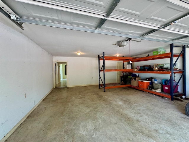 86 Huntington, Trinity, TX 75862 - garage with a garage door opener and baseboards