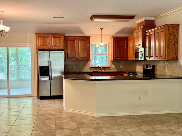 86 Huntington, Trinity, TX 75862 - kitchen featuring stainless steel appliances, plenty of natural light, decorative backsplash, and a sink