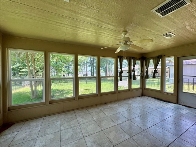 86 Huntington, Trinity, TX 75862 - unfurnished sunroom featuring tile patterned flooring