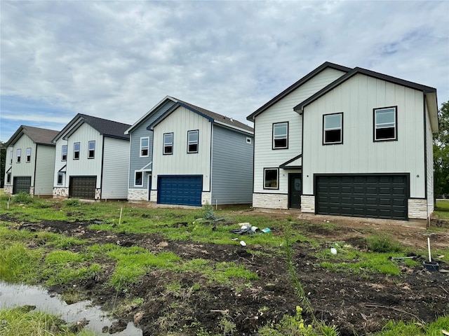 402 N 4th St, Beasley, TX 77417 - modern farmhouse with board and batten siding, an attached garage, and stone siding