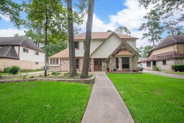 12210 Rocky Lake Ct, Houston, TX 77070 - view of front of home featuring a front lawn, brick siding, and roof with shingles