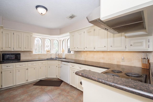 12210 Rocky Lake Ct, Houston, TX 77070 - kitchen with white dishwasher, black microwave, range hood, a sink, and tasteful backsplash