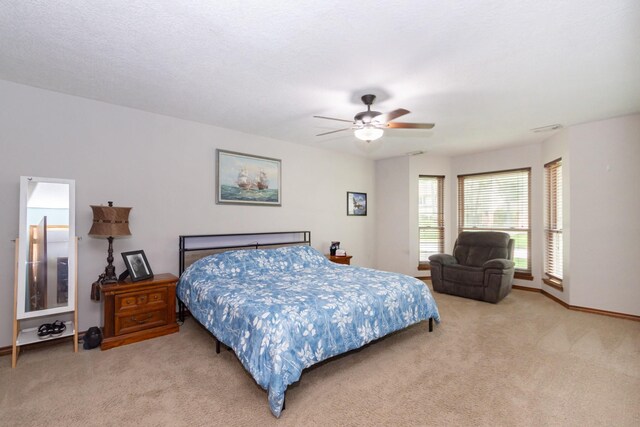 12210 Rocky Lake Ct, Houston, TX 77070 - bedroom with light carpet, baseboards, and a ceiling fan