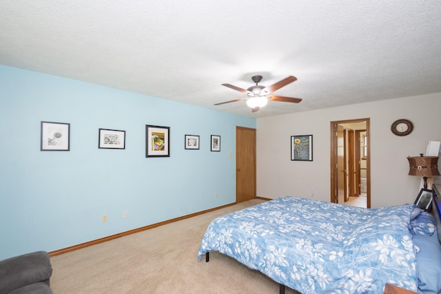 12210 Rocky Lake Ct, Houston, TX 77070 - bedroom featuring light carpet, baseboards, a ceiling fan, and a textured ceiling