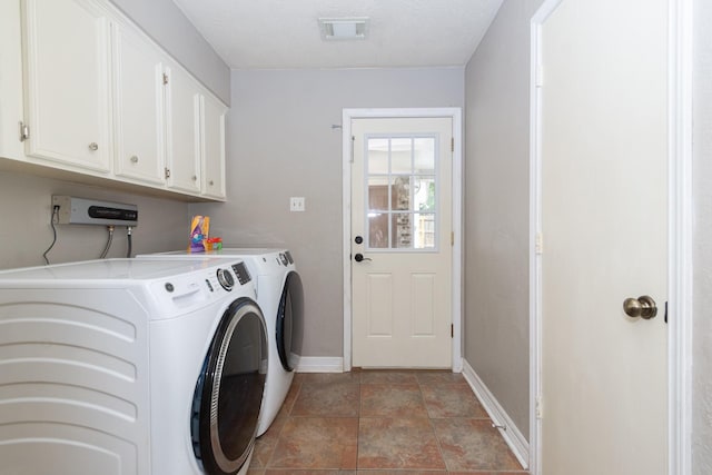 12210 Rocky Lake Ct, Houston, TX 77070 - laundry room with baseboards, cabinet space, and washer and clothes dryer