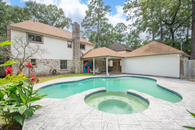 12210 Rocky Lake Ct, Houston, TX 77070 - view of pool featuring a pool with connected hot tub and a patio area