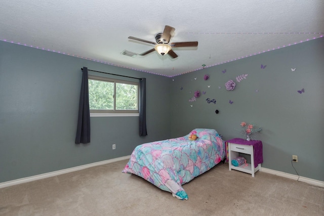 12210 Rocky Lake Ct, Houston, TX 77070 - bedroom featuring carpet, baseboards, a textured ceiling, and a ceiling fan