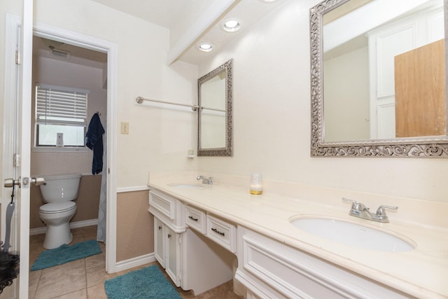 12210 Rocky Lake Ct, Houston, TX 77070 - bathroom with toilet, double vanity, tile patterned floors, and recessed lighting