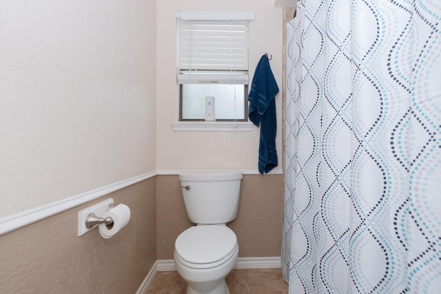 12210 Rocky Lake Ct, Houston, TX 77070 - full bathroom with toilet, tile patterned flooring, curtained shower, and baseboards
