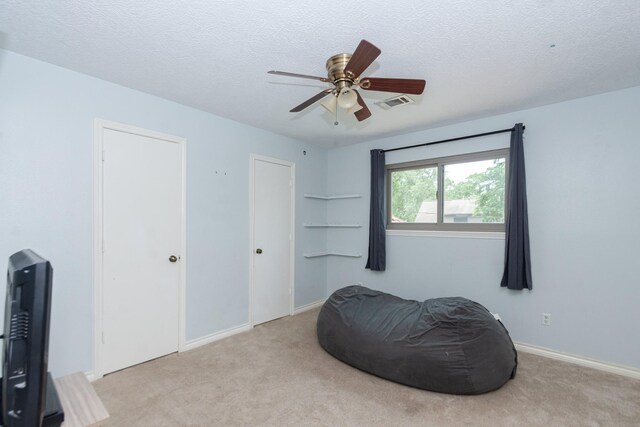 12210 Rocky Lake Ct, Houston, TX 77070 - living area with a ceiling fan, carpet floors, a textured ceiling, and baseboards