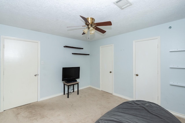 12210 Rocky Lake Ct, Houston, TX 77070 - carpeted bedroom featuring baseboards, a textured ceiling, and a ceiling fan