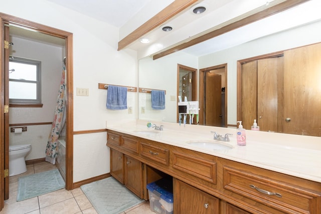 12210 Rocky Lake Ct, Houston, TX 77070 - full bath featuring double vanity, toilet, tile patterned flooring, baseboards, and shower / bath combo