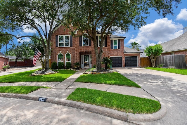 9611 Haven Crossing Ct, Houston, TX 77065 - view of front of property featuring concrete driveway and brick siding