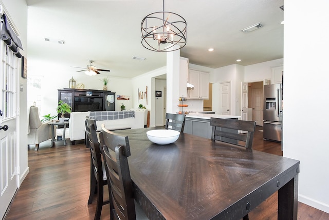 9611 Haven Crossing Ct, Houston, TX 77065 - dining space featuring a chandelier, a ceiling fan, dark wood finished floors, and recessed lighting