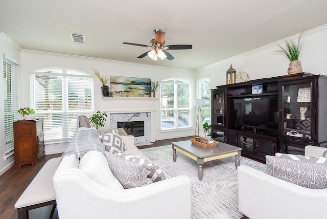 9611 Haven Crossing Ct, Houston, TX 77065 - living area featuring dark wood-type flooring, a ceiling fan, ornamental molding, baseboards, and a fireplace